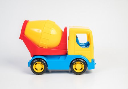 Plastic toy models of construction vehicles. Concrete mixer on a white background.の写真素材