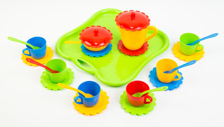 Children's toy multi-colored plastic tableware on a white background.の写真素材
