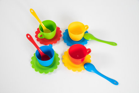 A set of multi-colored children's plastic utensils for games on a white background.の写真素材