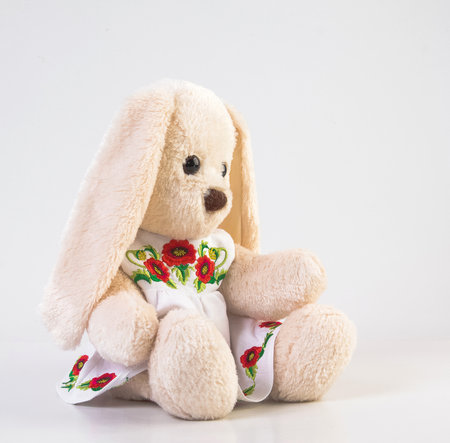Toy plush bunny on a white background for children's games.の写真素材