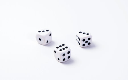 White game dice on a white background. Selective focus.の写真素材