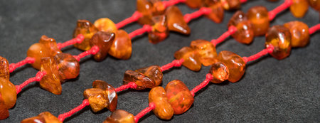 Jewelry made of natural amber stones. Selective focus.の写真素材