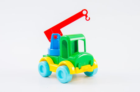 Plastic toy multi-colored truck on a white background.の写真素材