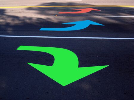 Colorful sign of arrows on the ground.