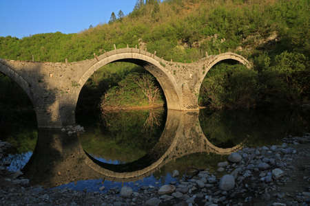 Old Stone Bridge called Plakida or Kalogeriko in Zagori area, Epirus, Greeceの写真素材