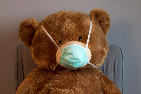 Coronavirus, Covid-19 - teddy bear in protection maskの写真素材