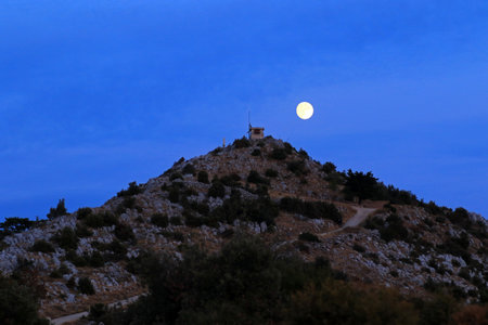 Moon over the mountain at night, Hvar island, Croatiaの写真素材