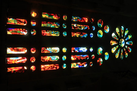 Colorful stained glass window in the church, closeup of photo