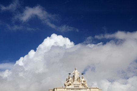 Statues by CÃ©lestin Anatole Calmels: Glory rewarding Valor and Genius, Rua Augusta Arch, Praca do Comercio (Commerce Square), Lisbon, Portugalの写真素材