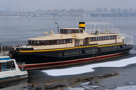 River ships at a mooring in ice, against spring.の写真素材