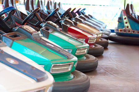 Electric cars at the amusement park, amusement outdated entertainmentの写真素材