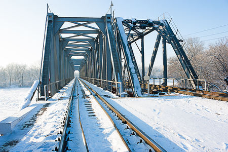 Railway bridge over the river in winter