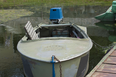 fishing boat with the motor at the pierの写真素材