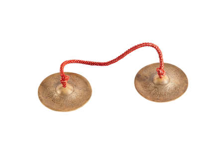crotales antique cymbals tingsha bells isolated on white backgroundの写真素材