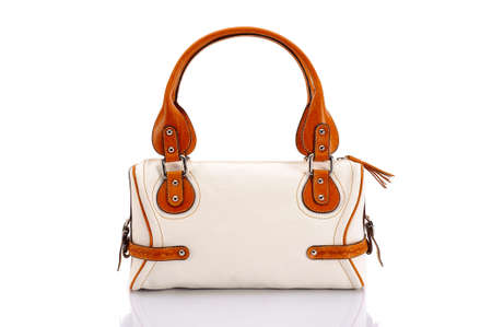 Leather ladies bag on a white background. Beautiful, fashionable, accessory, isolated. Interesting design, the texture of the skin. Comfortable handle.の写真素材