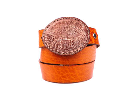 Belt male leather.The fashionable accessory is twisted on a white background.With a metal buckle.Natural animal skin.の写真素材