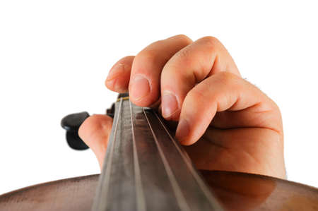 Image violin lies in a human hand.String instrument isolated on white background.Fingers play music