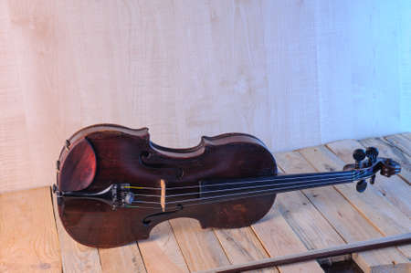two  violin image .old brown stringed wooden instrument isolated on the white backgroundの写真素材