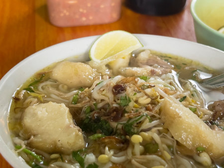 Thai style noodle soup with pork and fish ball in bowl