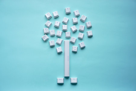 keyboard keys shaped like a tree isolated on a turquoise background.の写真素材