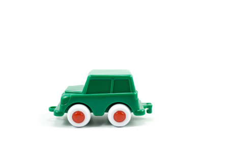 Green paint plastic toy terrain car isolated on white background.の写真素材