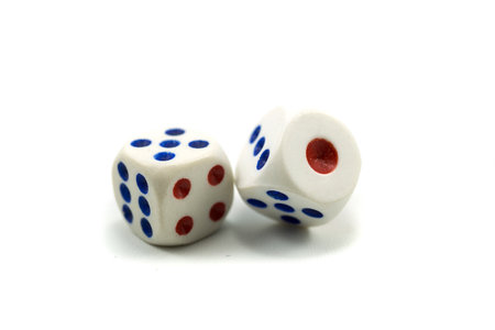 Three plastic dice isolated on a white background, a dice is a small object generally in the shape...