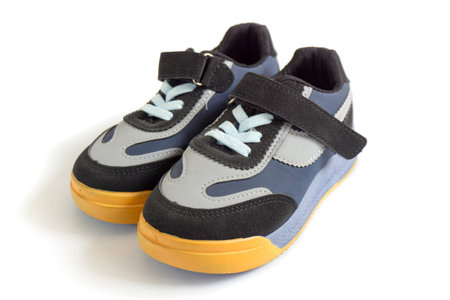 gray and black baby shoes isolated on white background, summer footwear, children's shoes.の写真素材