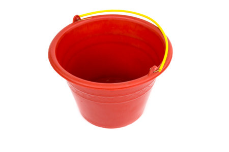 Red plastic bucket with yellow handle isolated on white background, empty plastic bucket used to carry candy when Halloween.の写真素材