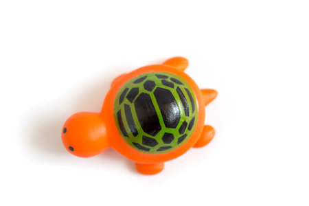 toddler toy orange rubber turtle used to play when bathing isolated on a white background.の写真素材