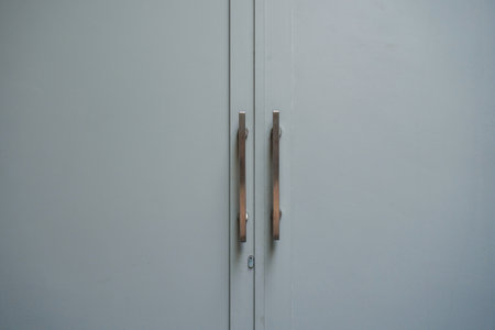 The door handle of an office is in the middle of a minimalist background.の写真素材