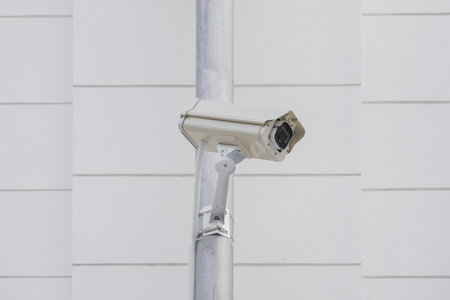 CCTV cameras on metal poles so as not to damage building walls to monitor, observe and record...