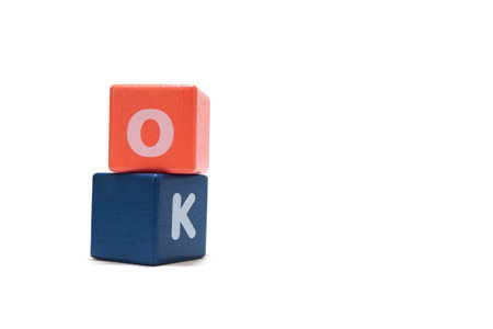 text OK on colorful wooden isolated on a white backgroundの写真素材