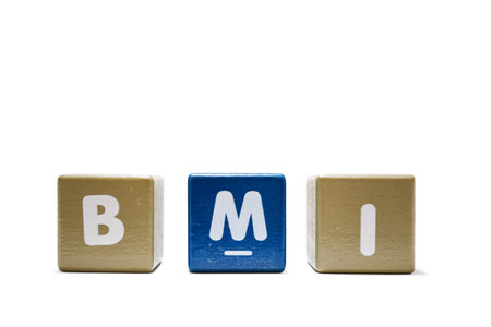 text BMI Body Mass Index on colorful wooden isolated on a white background.の写真素材