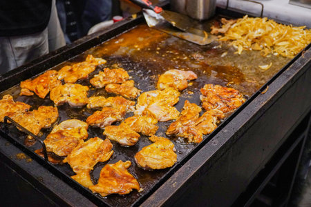 Grilled chicken steak on steak stove.の写真素材