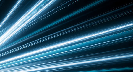 An abstract background composed of numerous bright blue and white light streaks radiating from a...