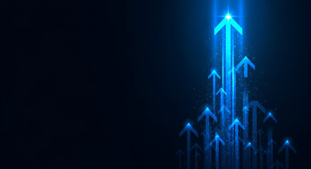 A cluster of blue arrows, each emitting a bright, radiant light from its tip, points upwards and to the left against a deep, dark background. The varying sizes and positions of the arrows create a sense of collective upward momentum and aspiration. Small, sparkling light particles enhance the dynamic and futuristic feel.の写真素材
