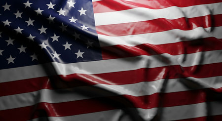 A detailed, close-up view of a rippling American flag. The red and white stripes are clearly...