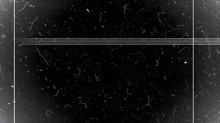 A black surface is covered with numerous small white specks of dust and thin, wavy white lines...