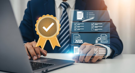 A person in a suit and tie sits at a desk with a laptop, interacting with a holographic display. The display features a golden award ribbon with a checkmark, alongside multiple digital checklists and document icons, indicating quality control and successful task completion.の写真素材