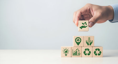 A person's hand is holding a wooden block with a seedling in a hand icon and is about to place it on...