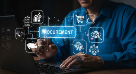 A person's hands are on a laptop keyboard, interacting with a digital interface displaying a flowchart of procurement processes. Icons representing various aspects of procurement, such as a shopping cart, handshake, delivery truck, and analytics graph, are connected by lines to a central "PROCUREMENT" label. The image conveys the digital transformation and interconnectedness of modern business operations.の写真素材