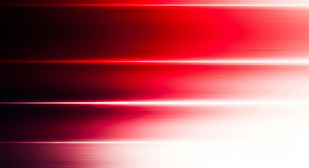 This abstract image features horizontal streaks of bright red light against a dark background. The light appears to be in motion, creating a sense of speed and energy. The streaks vary in intensity, with some being very bright and others more diffused, creating a gradient effect from dark red to white. The overall impression is one of dynamism and futuristic technology.の写真素材