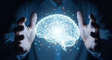 A close-up shot of two human hands cupping a brightly glowing, wireframe model of a human brain. The...
