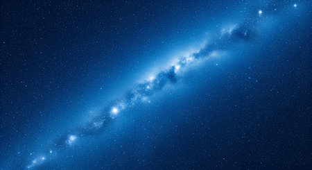 A vibrant blue nebula swirls with bright stars in the vast expanse of deep space. The celestial formation appears luminous and detailed, with a central bright core and scattered smaller stars. The image evokes a sense of cosmic wonder and the immense scale of the universe.の写真素材