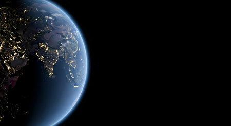 A detailed view of planet Earth from space at night. The illuminated city lights of continents are...