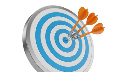 Three orange darts are precisely embedded in the bullseye of a blue and white circular target. The...