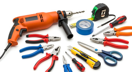 Power showing assorted hand tools and power drill on whitebackground. High resolution image suitable...