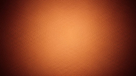 Orange leather texture background for interior or exterior design with copy space for text or image.の写真素材