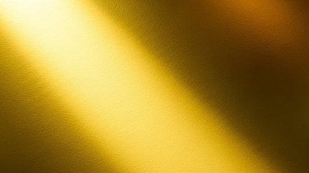 Yellow wall with light and shadow. Abstract background and texture for design.の写真素材