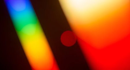 An abstract image featuring a vibrant spectrum of colors, resembling a rainbow, with soft bokeh...